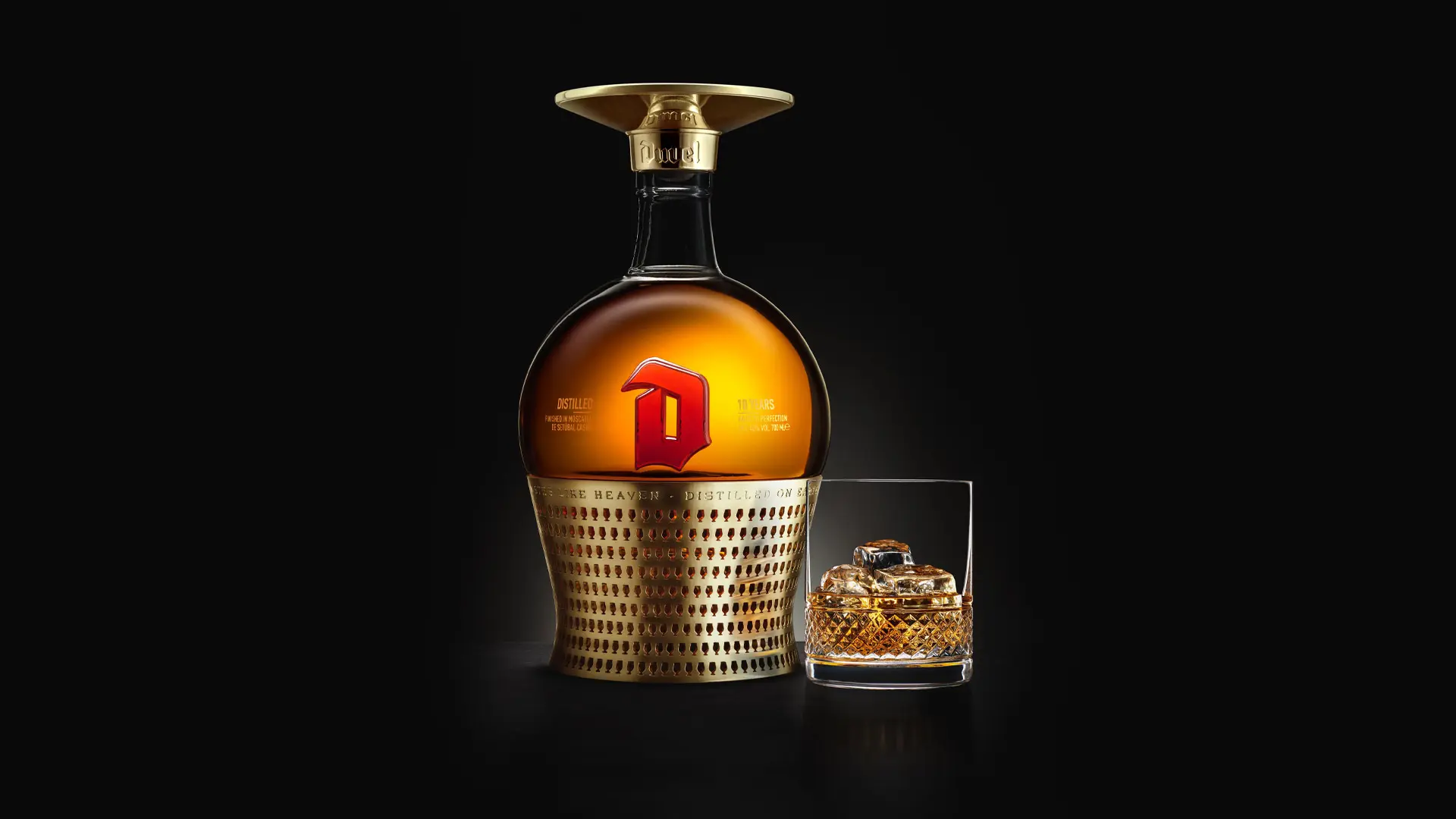 Duvel distilled 150 years celebration bottle packshot with glass.