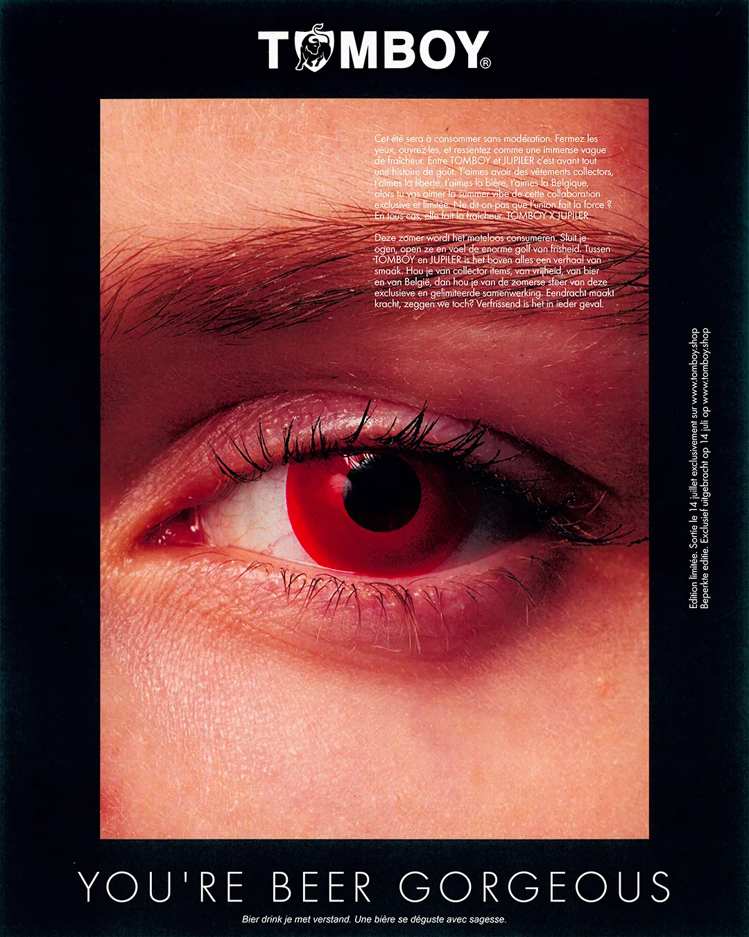 Poster for the Tomboy x Jupiler campaign showing a close-up of a red eye.