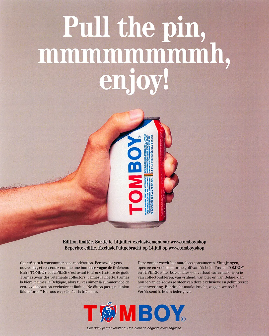 Poster for the Tomboy x Jupiler campaign showing a close-up of a hand holding a beer can.