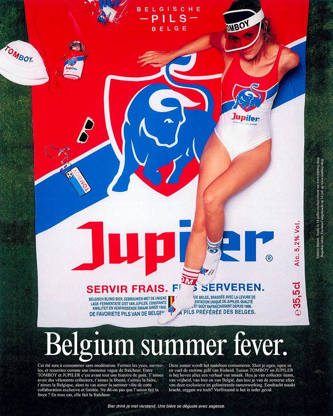 Poster for the Tomboy x Jupiler campaign showing a young woman on a beach towel on the grass.